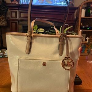 White Michael Kors patent leather bag. Gently used a few times.